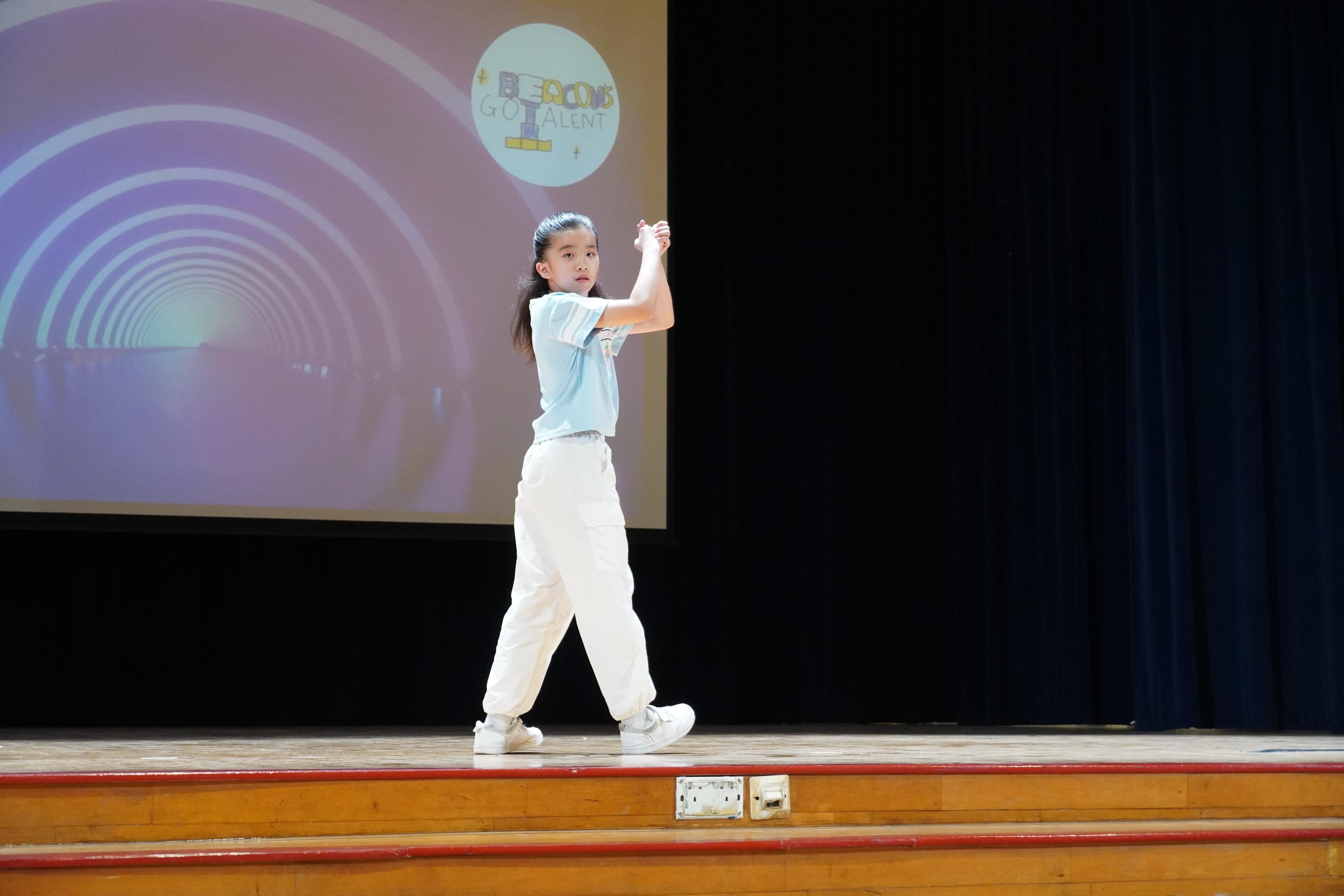 Bringing energy to the stage! With confident moves and plenty of enthusiasm, our student gave the audience a performance to remember.